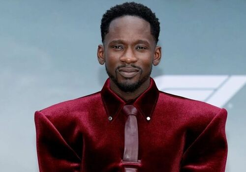 Mr Eazi Steals the Show in Burgundy Velvet